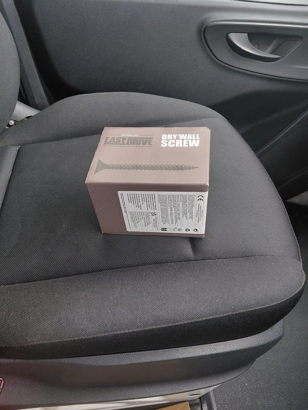 Urgent parcel travelling safely on the passenger seat of a Birdview van